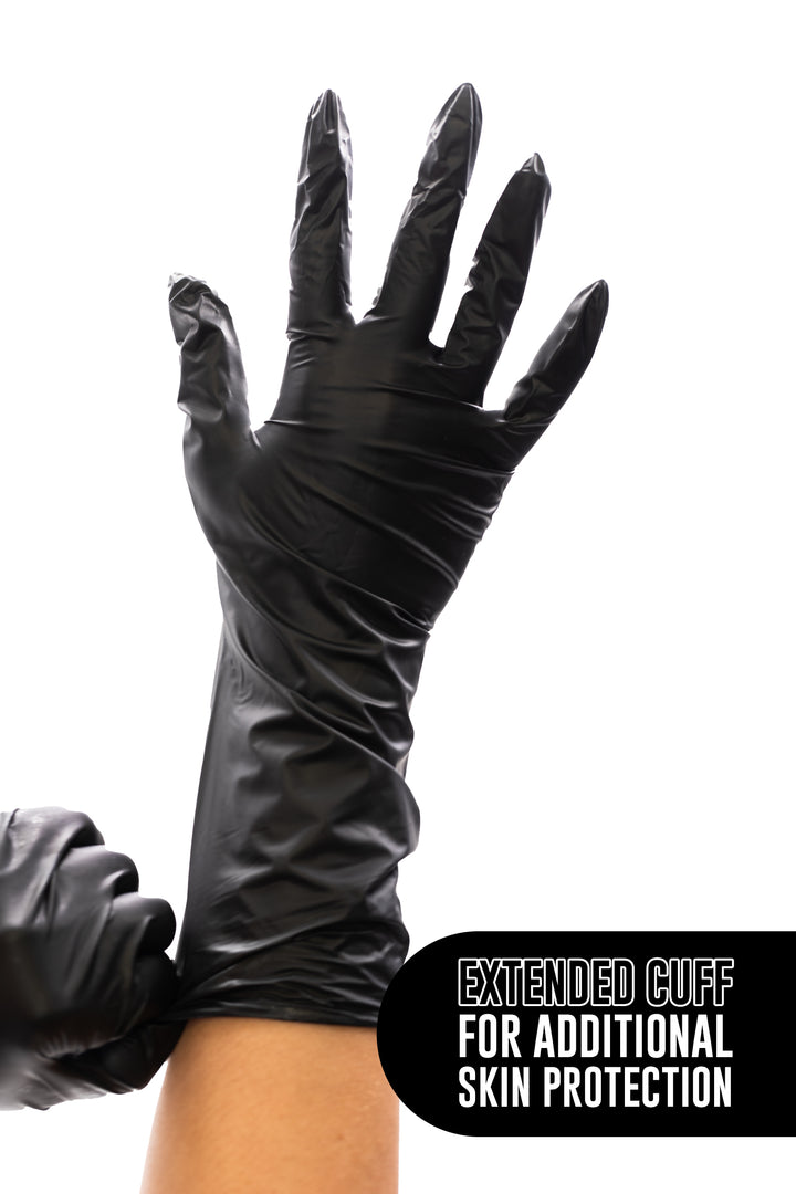 Black vinyl glove with the cuff extending well up the forearm, with the text Extended cuff for additional skin protection