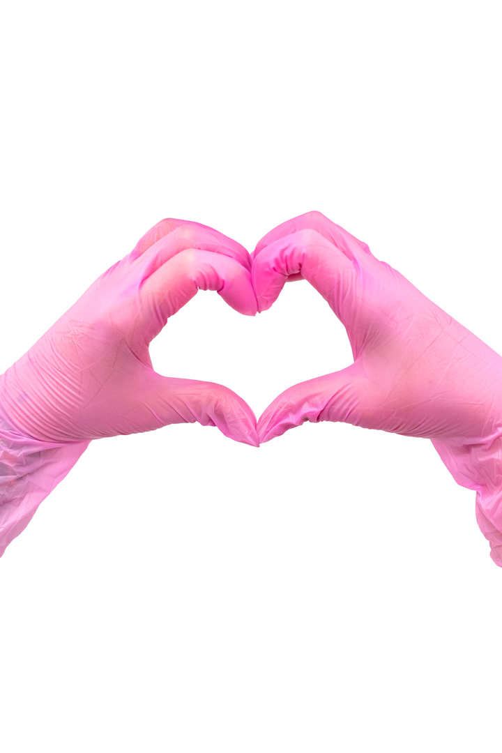 Two gloved hands forming a heart shape