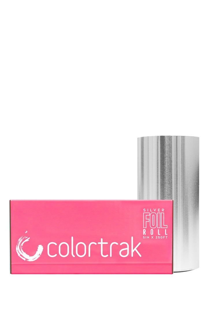 Colortrak smooth silver foil roll, non-embossed, 5 inches x 250 feet, standing next to its pink dispenser box
