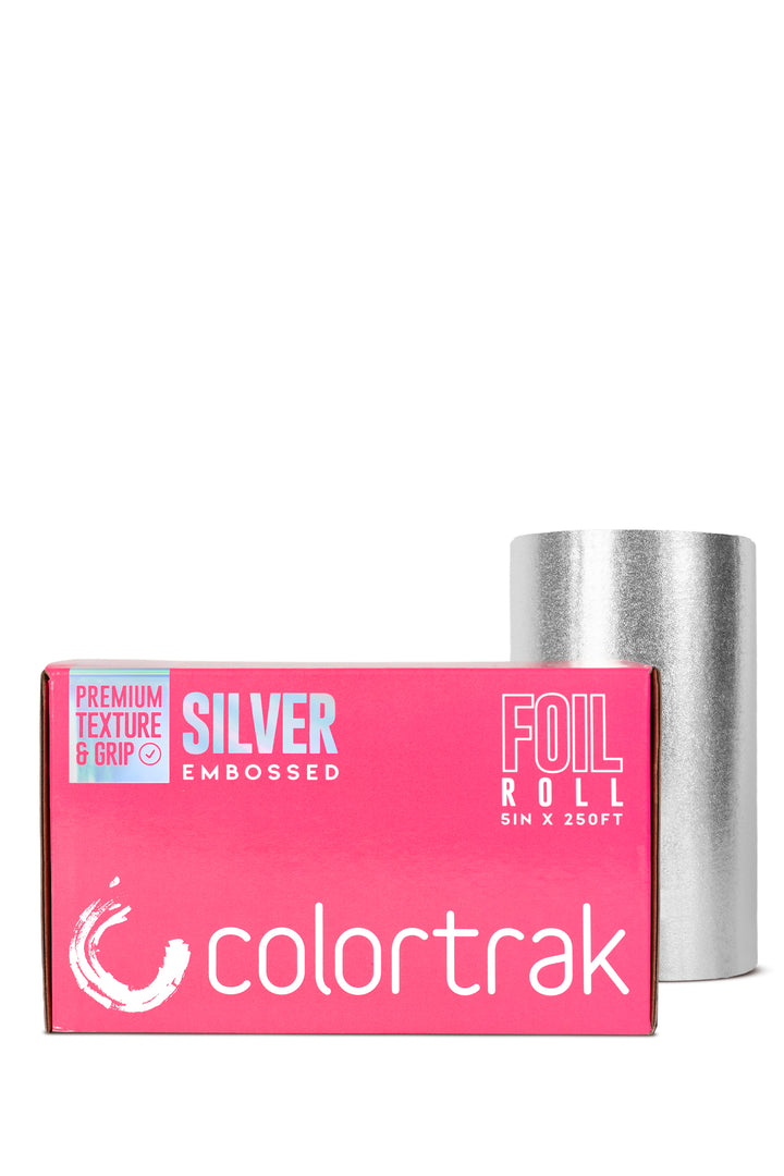 Colortrak embossed silver foil roll, 5 inches x 250 feet, standing next to its pink dispenser box