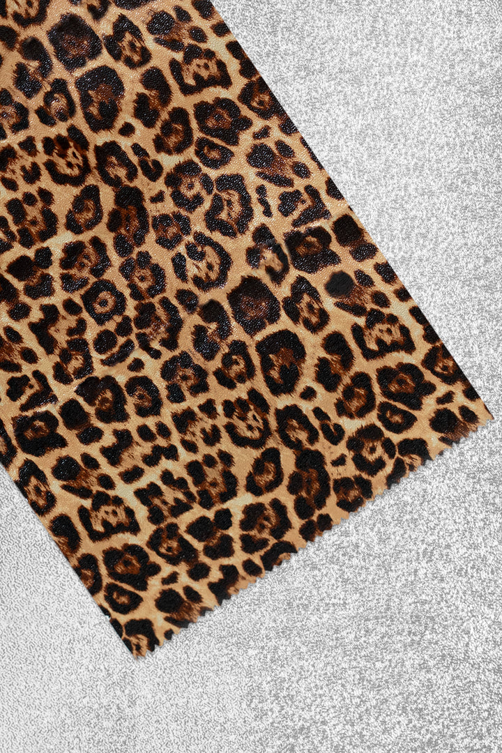 Foil sheet folded back to show the print up close: classic tan, brown and black leopard spots. Plain silver on the reverse side.