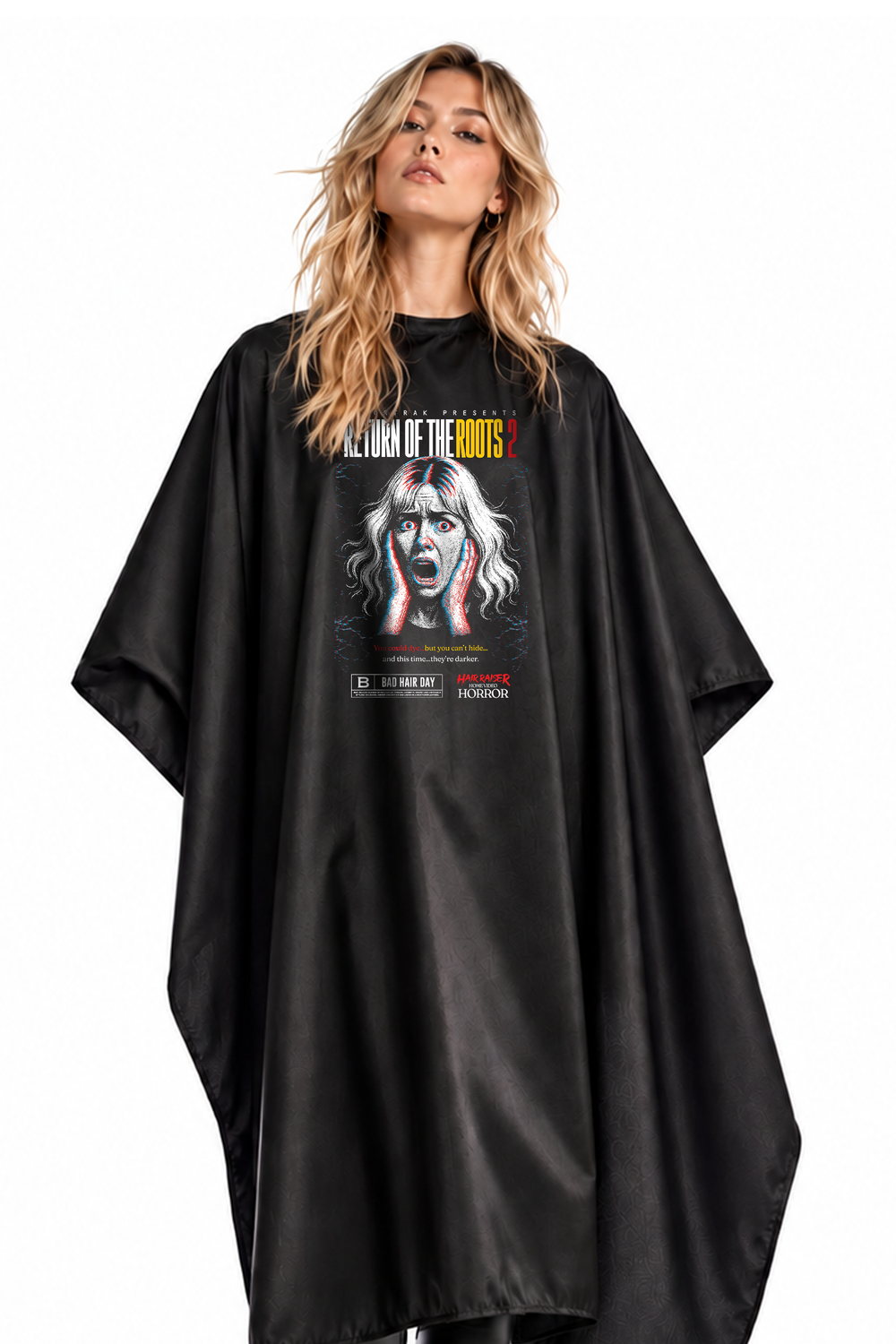 A model wearing a black salon cape with a large graphic print on the front featuring the Return of the Roots Hair Raiser Print