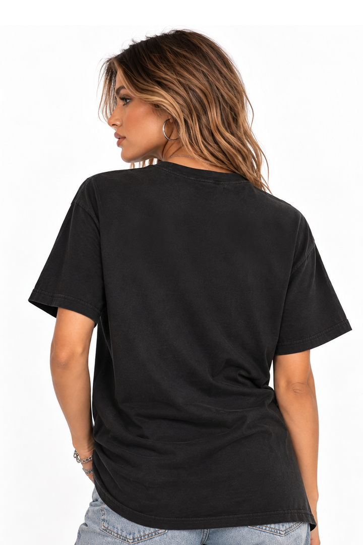 Back of the black tee on a second model, plain with no print, relaxed fit